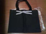 New black bag in plastic bag
