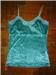 velvet camisole.
laced decorations at bust line.
slightly stretchable straps.
slight furring on inner side of cami, but not in the least uncomfortable. (: