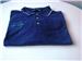 Used authentic Ebonite The One polo shirt. 6.2 ounce/100% Ring Spun Combed Cotton Locker patch, Side vents, Double-needle stitched, Etched buttons Machine Wash/Tumble Dry, Soft feel with a crisp look. Distinctive detailing on collar and cuffs for a professional appearance. 

Colour: Navy