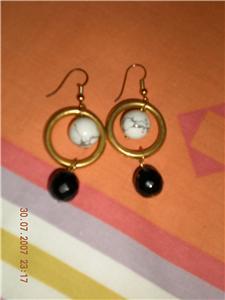 golden, black and white earrings